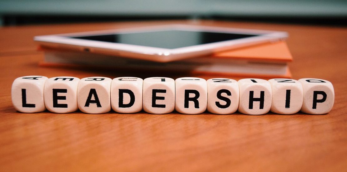 Letter cubes on a desk that spell Leadership