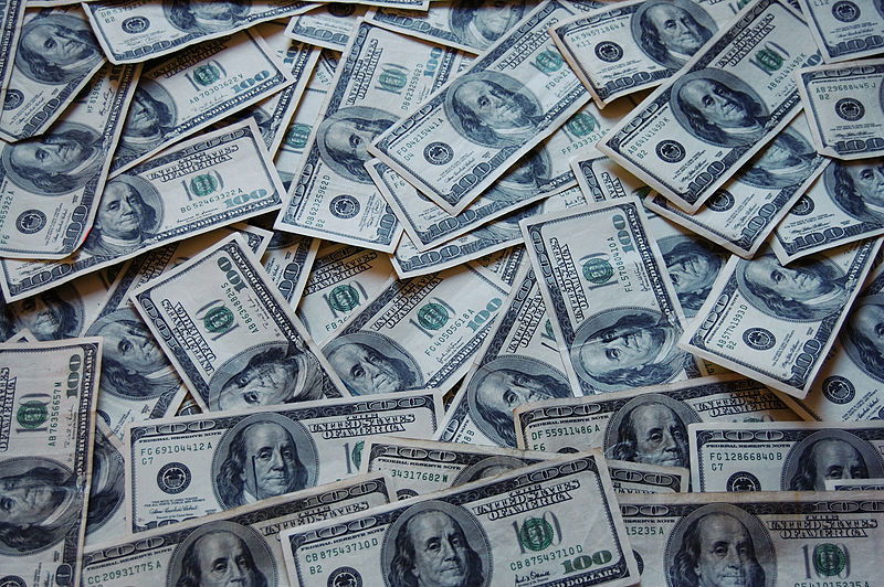 Big pile of cash. Lenders can help small businesses succeed by making loans easer to get at lower rates.